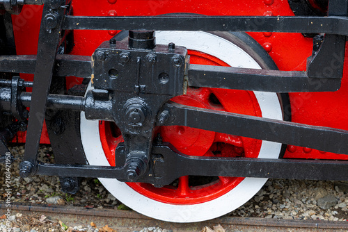 Cuadro en lienzo Steam locomotive driving wheel with connecting rod crankpin valve gear and piston linkage on narrow gauge track with ballast