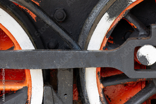 Obraz na płótnie Steam locomotive driving wheels with connecting rod crankpin valve gear and piston linkage on narrow gauge track with ballast