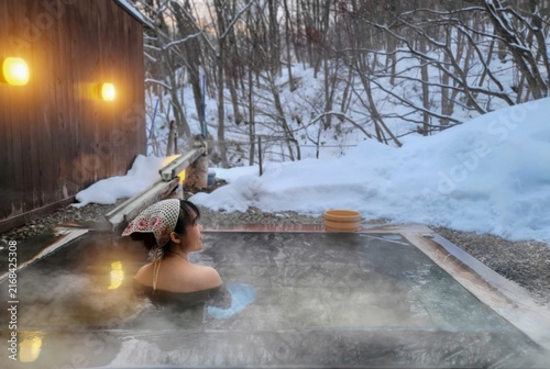 Japanese people are relaxing in a hot spring.	