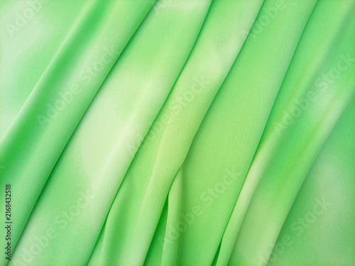Light green pastel with a subtle gradient abstract layered fabric texture or textile background. Soft and calming background for websites, banners, or graphic design projects