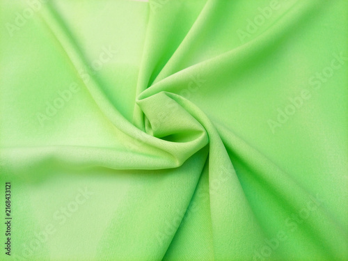 Light green pastel with a subtle gradient abstract swirled fabric texture or textile background. Soft and calming background for websites, banners, or graphic design projects