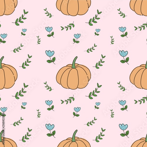 Autumn seamless pattern with pumpkins, blue flowers and green leaves on pink background