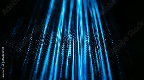 Abstract blue light streaks flowing through dark texture background