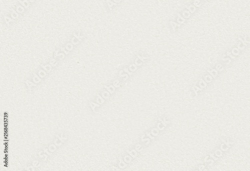 White paper texture background with empty space for text. Simple light cream color surface. Blank cardboard sheet