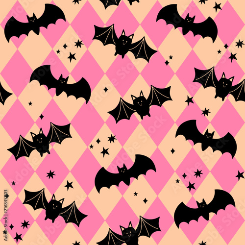 Halloween seamless pattern. Cute bats on a background with pink rhombuses. Repeating vector print for wrapping, textile, decoration. Halloween party. Fall holiday illustration.