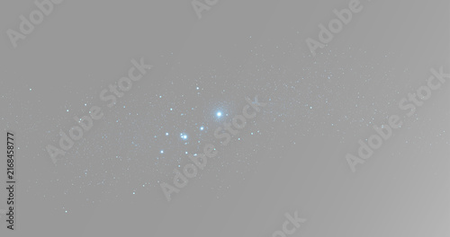 Glowing blue stardust with small cosmic particles, glitter and stars scattered across a narrow horizontal space trail