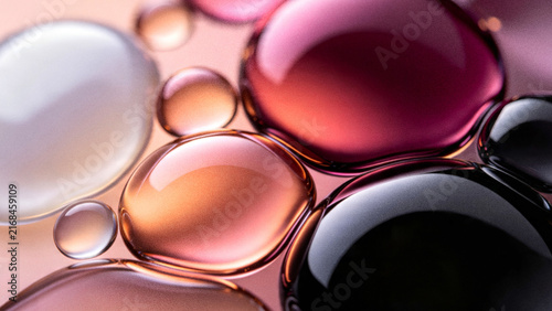 Abstract 3D grainy background featuring floating liquid glass oil bubbles with premium black pink rose gold and white iridescent holographic gradient refractions.