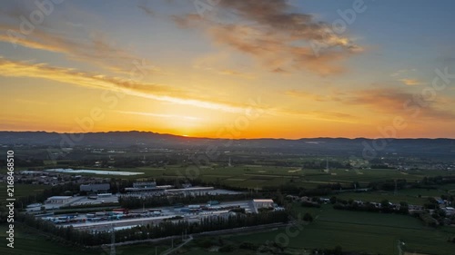 Aerial Video of Sunrise over Highway Service Area with Farmland and Trucks