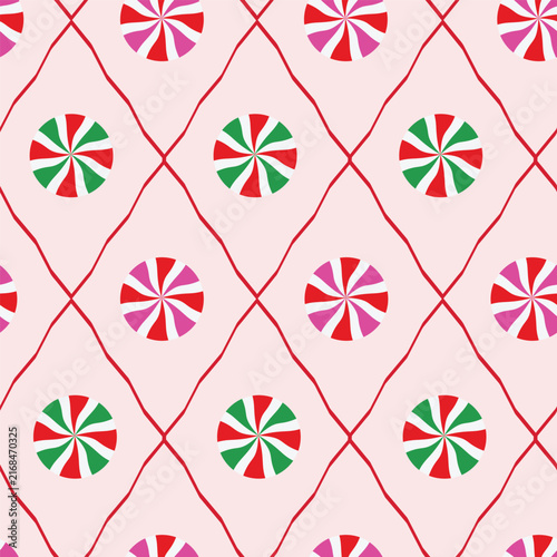 Christmas Candy Peppermint seamless pattern on wavy red diamonds. For Christmas backgrounds, decorations and wrapping paper,