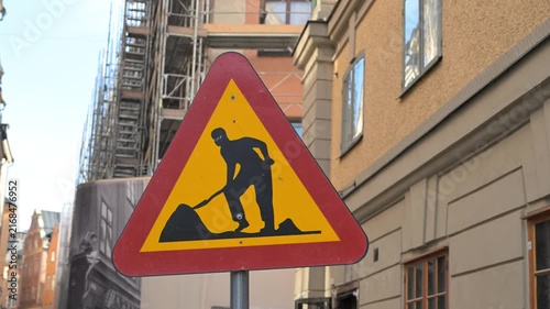 Roadworks ahead warning traffic sign. Construction zone warning traffic sign. Temporary roadworks ahead.