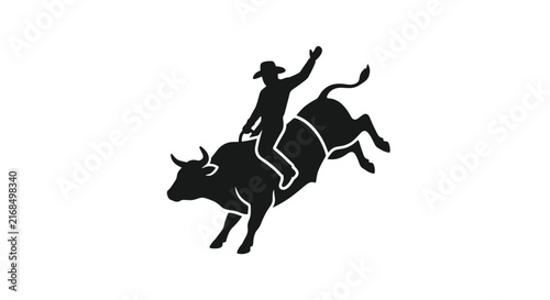Silhouette of a cowboy riding a bucking bull 1.
