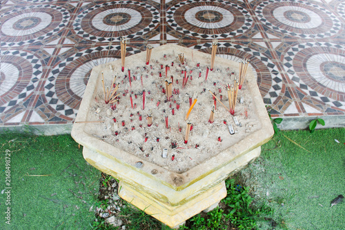 Konstfotografi Incense sacrificial offering in Joss stick pot or thurible incense burner for th