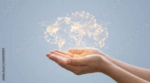 Pair of human hands gently holding a glowing digital world map made of connected dots and lines, representing global connectivity and care, internet of things, cloud computing