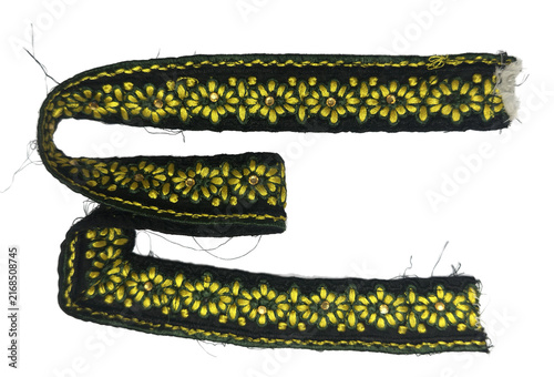 Folded black jacquard woven tape with yellow floral embroidery cutout
