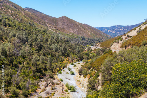 Scenic mountain landscape with a dry rocky riverbed in Tuolumne County California.