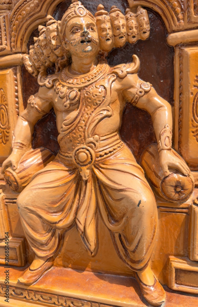 Fototapeta premium Intricate wooden carved sculpture of ten headed Ravana from Indian mythology