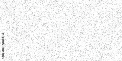 Soft light grey speckled texture with scattered small particles on a white background, creating a clean grainy surface pattern minimalist layouts and digital backdrops