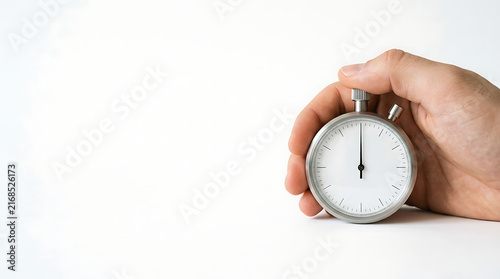 Person holding a classic mechanical stopwatch on a clean white background representing time management and deadlines