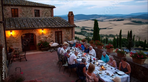countryside family gathering around a long outdoor dinner table, homemade food, vineyards stretching into rolling hills, warm Mediterranean culture