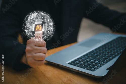 Close-up of businessman using laptop with floating AI command prompt and icons, representing artificial intelligence, prompt engineering, generative technology for digital transformation.