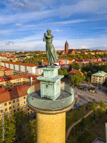 Aerial view of Sjomanstornet featuring a bronze statue of a woman atop a brick tower with a copper observation deck overlooking the cityscape of Goteborg, Vastra Gotalands lan, Sweden.