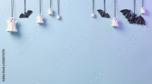 Hanging decorative ballet slippers on strings against a light blue wall