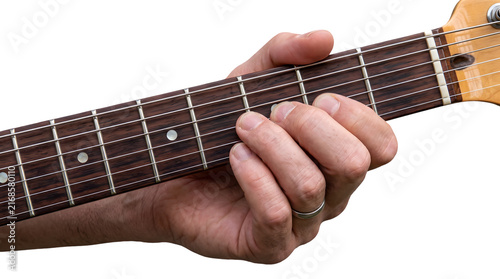 Quadro su tela Close-up of hand playing acoustic guitar fretboard with fingers pressing strings
