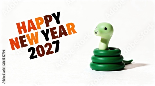 Cute green snake figurine with Happy New Year 2027 text on white. Toy mascot celebrating the 2027 calendar transition. Festive greeting concept for marketing and seasonal social media banners.
