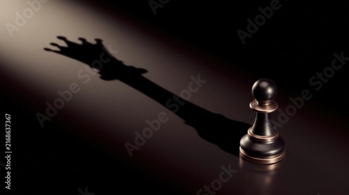 Chess pawn casting a large shadow shaped like a crown