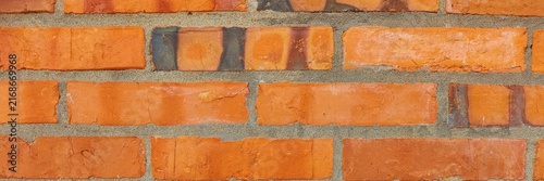 Foto Rough red brick wall texture presenting full frame close up background