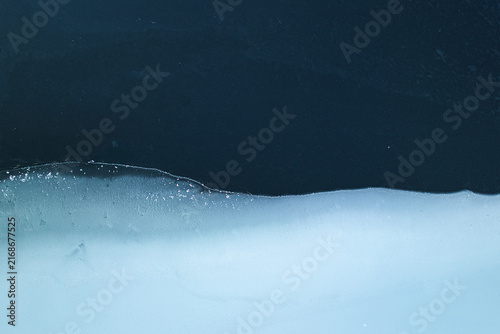 Abstract aerial view of frozen lake and snow forming natural winter patterns
