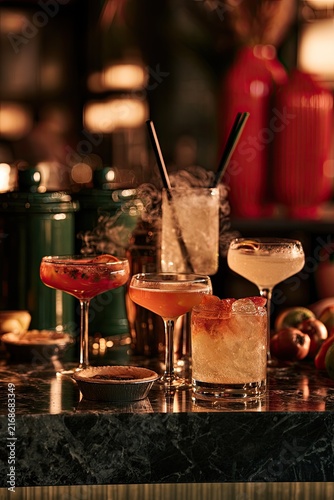 Five elegantly served cocktails arranged on a dark marble bar top