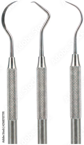 Foto Three stainless steel dental hooks on black background.