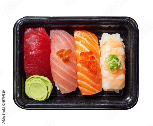 Fresh Salmon Sushi Rolls and Sashimi Served on a Plate with Japanese Rice, Wasabi and Gourmet Seafood for a Healthy Japanese Cuisine Meal