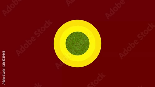 Abstract concentric circles animation with green center and yellow rings on dark red background