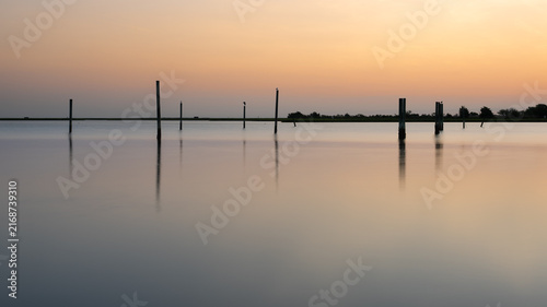 Sunrise Reflections and Wooden Pilings at Messick Point, Virginia