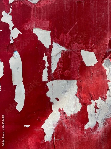Peeling Red and White Paint Texture on Weathered Wall