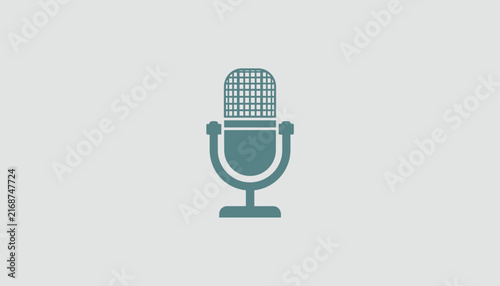 Vintage style retro vocal microphone icon in a soft slate blue color on a minimalist light grey background design.