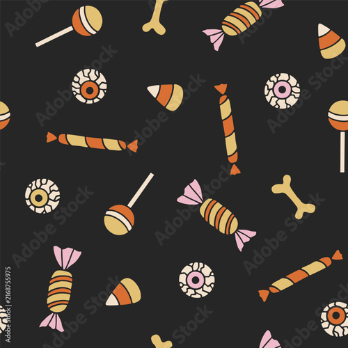 Halloween vector seamless pattern with sweets, candy corn, bones, spooky eyeball treats on black background. Creepy festive pattern for holiday design, prints, wrapping and textile. Cute kids pattern
