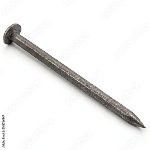single long iron nail lying flat