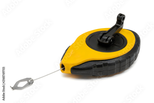 Chalk line reel tool yellow and black for construction use.