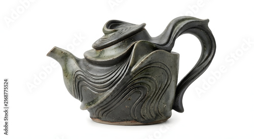 Handmade ceramic teapot with wavy abstract textured glaze isolated on white background.