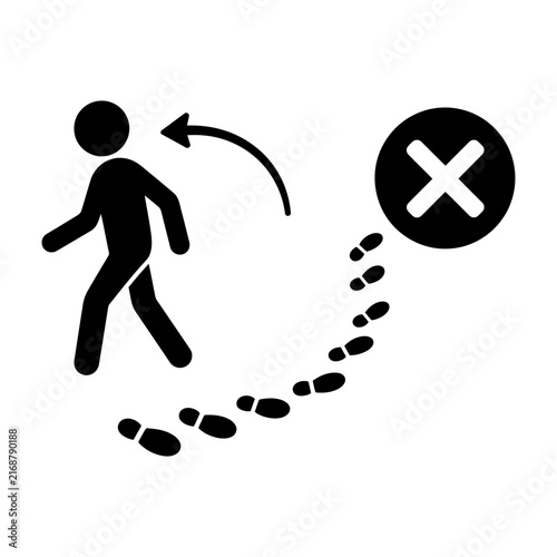 Silhouette of a person walking backward with footprints leading to a crossed-out mark indicating failure or incorrect direction.