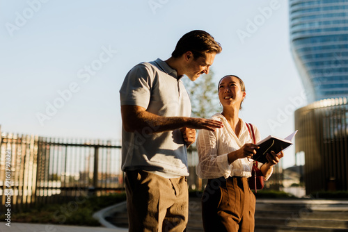 Exploring together in a vibrant urban landscape during golden hour