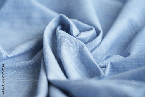 Light blue cotton fabric with soft folds background