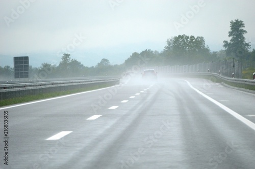the car picked up rainwater on the road