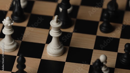 chess on a wooden board going around in circle