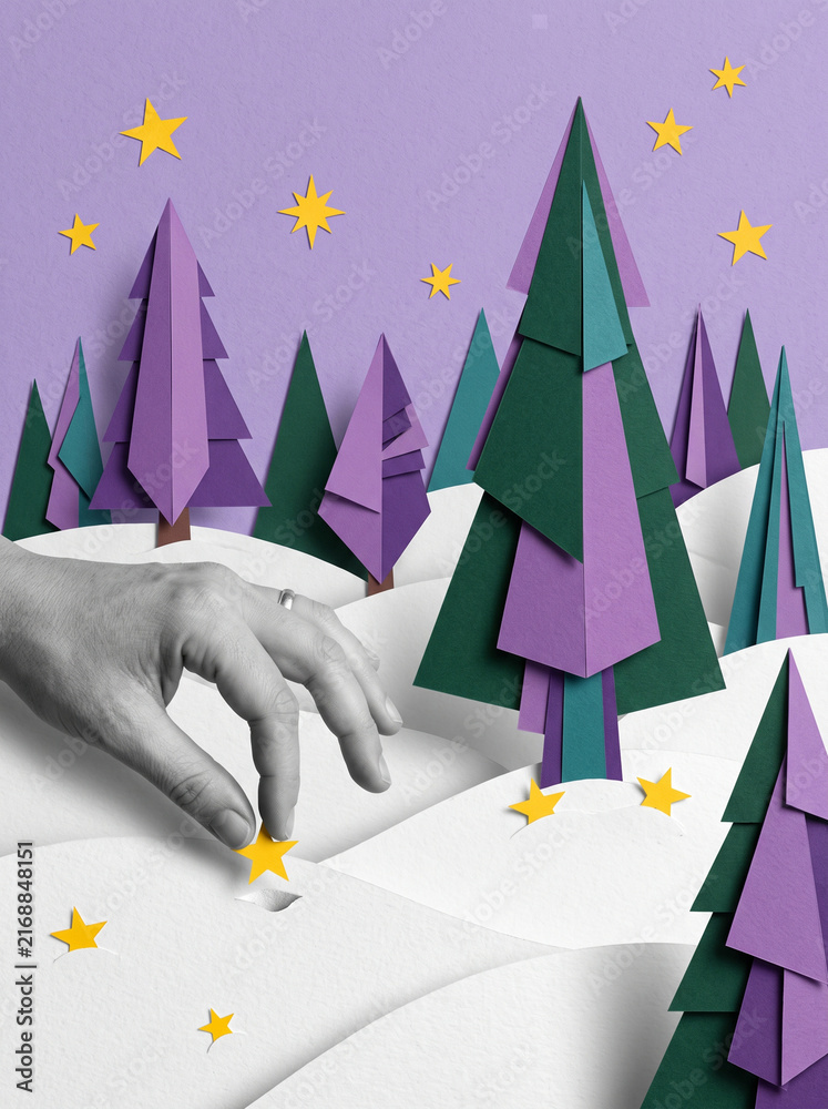 Naklejka premium Paper cut winter landscape with purple trees green forest yellow stars and a grayscale hand reaching through snow