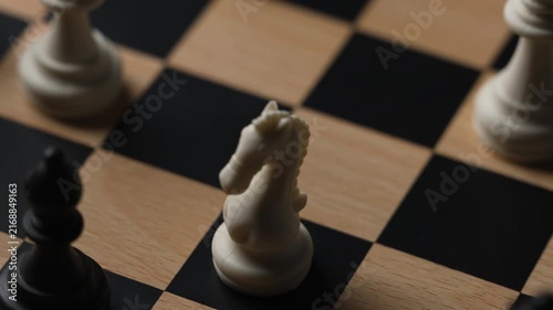 chess on a wooden board going around in circle