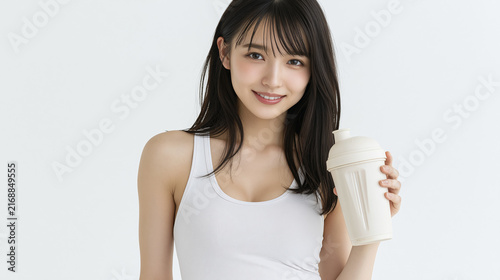 Smiling Fitness Woman Holding Takeaway Drink on Minimal Background